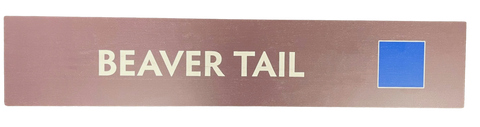 Wooden trail sign with the text, 'Beaver Tail' and a blue square icon