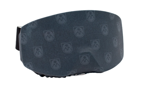 Protective cover over the lens of a pair of ski goggles.