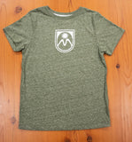 Green tshirt with Meadows shield logo on the center chest.