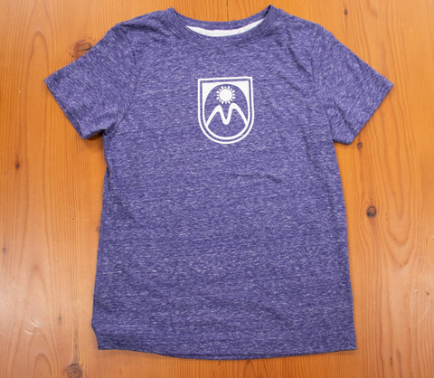 Purple tshirt with Meadows shield logo on the center chest.