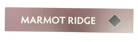 Wooden trail sign with the text, 'Marmot Ridge' and a black diamond icon