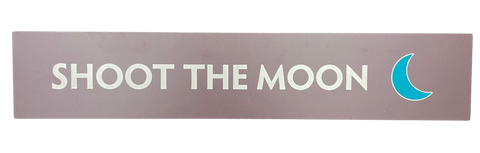 Wooden trail sign with the text, 'Shoot the Moon' and a green crescent moon icon