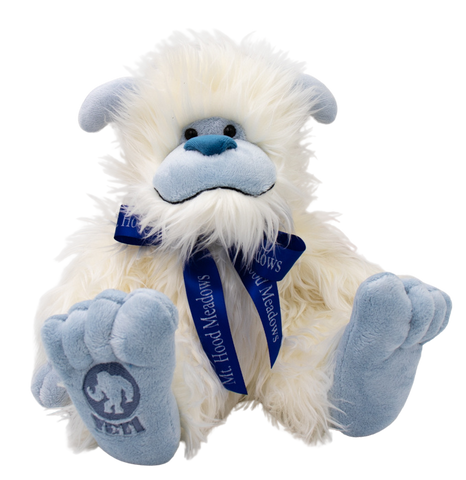 Yeti plushy with blue Meadows ribbon.