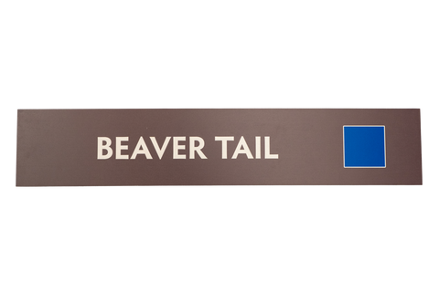 Rectangular sign with 'BEAVER TAIL' text on a brown background