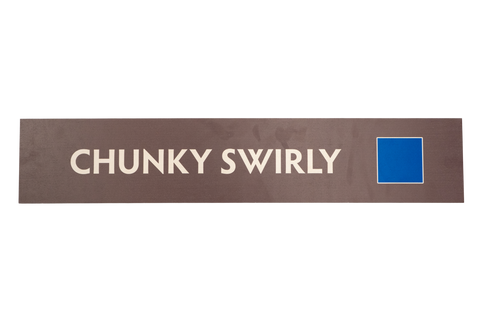 Brown rectancular sign with,'Chunky Swirly' text and a blue square icon
