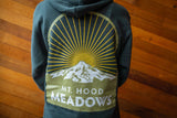 A persons torso showing the back print of a hoodie featuring Mt. Hood Meadows.