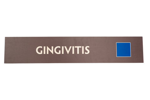 Rectangular sign with 'GINGIVITIS' text on a brown background and a blue square icon