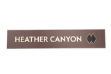 Rectangular sign with 'HEATHER CANYON' text