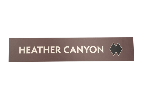 Rectangular sign with 'HEATHER CANYON' text