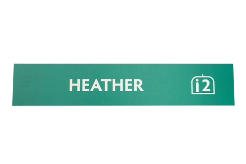 Green rectangular label with 'HEATHER' text