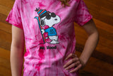 Person wearing a pink tie-dye t-shirt with a cartoon character design 