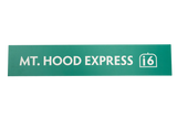 Green rectangular sign with 'Mt. Hood Express' text and a 6 seat icon