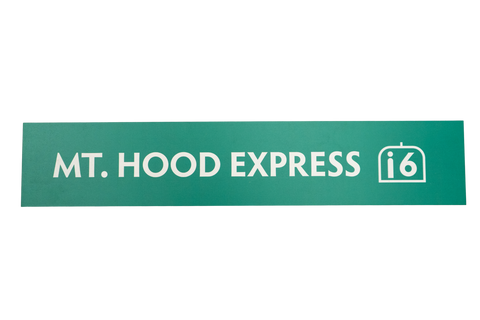Green rectangular sign with 'Mt. Hood Express' text and a 6 seat icon