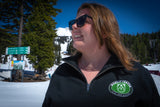 head and shoulder image of a person wearing a 1/4 zip sweater