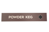 Rectangular sign with 'POWDER KEG' text on a brown background