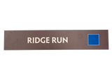 Rectangular sign with 'RIDGE RUN' text on a brown background