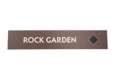Rectangular brown sign with 'ROCK GARDEN' text with a black diamond icon
