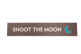 Brown rectangular sign with 'Shoot the Moon' text and a green crescent moon icon