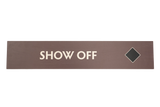 Rectangular brown sign with 'SHOW OFF' text a a black diamond icon