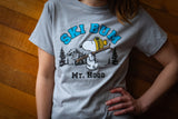 Person wearing a gray t-shirt with a Snoopy graphic and 'Ski Bum Mt. Hood' text.