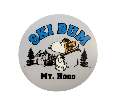 Sticker with Snoopy holding skis and 'Ski Bum Mt. Hood' text on a grey background