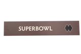 Brown rectangular sign with 'SUPERBOWL' text