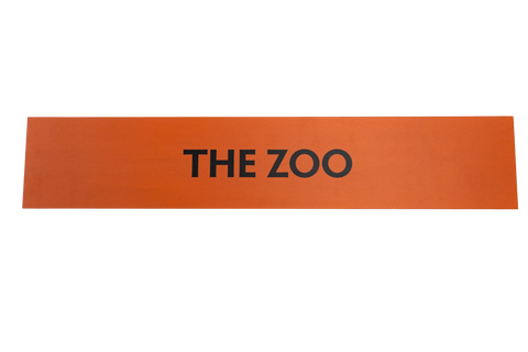 Orange sign with 'THE ZOO' text on a white background
