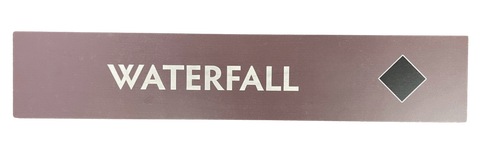 Wooden trail sign with the text, 'Waterfall' and a black diamond icon