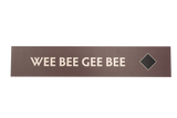 Rectangular brown sign with 'WEE BEE GEE BEE' text and a black diamond icon