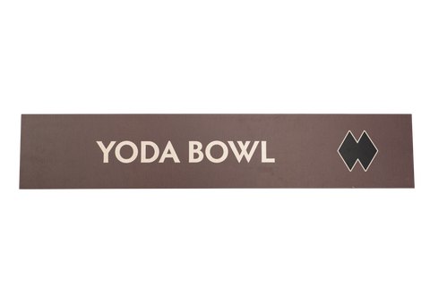 Rectangular brown sign with 'Yoda Bowl' text and a double black diamond icon